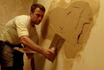 Why do plasterboards need a skim coat of plaster?